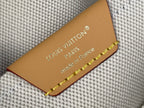 Louis Vuitton leather brand tag with gold lettering and braided trim