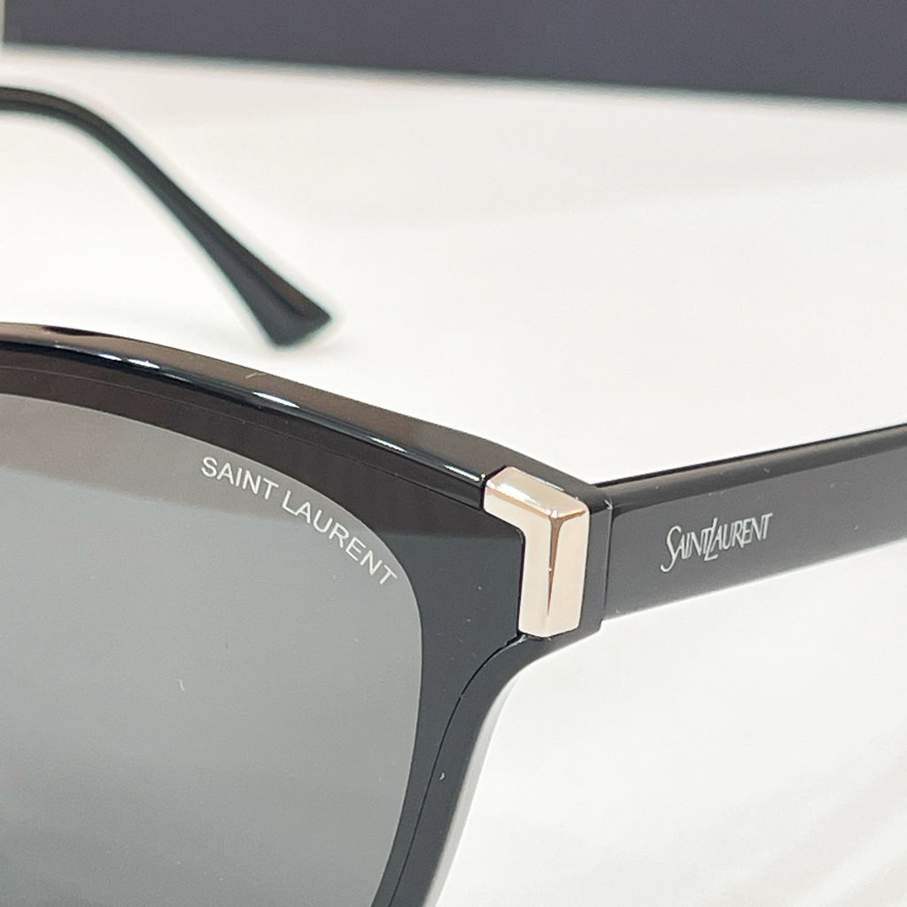 YSL black sunglasses temple close-up with gold metal logo detail