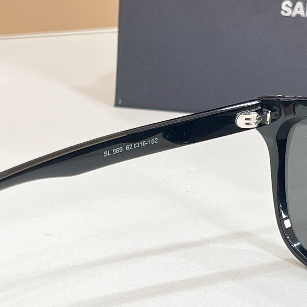YSL black sunglasses temple close-up with model numbers printed on arm