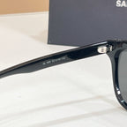 YSL black sunglasses temple close-up with model numbers printed on arm