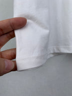 Dior short-sleeve T-shirt, cuff/hem seam close-up in white