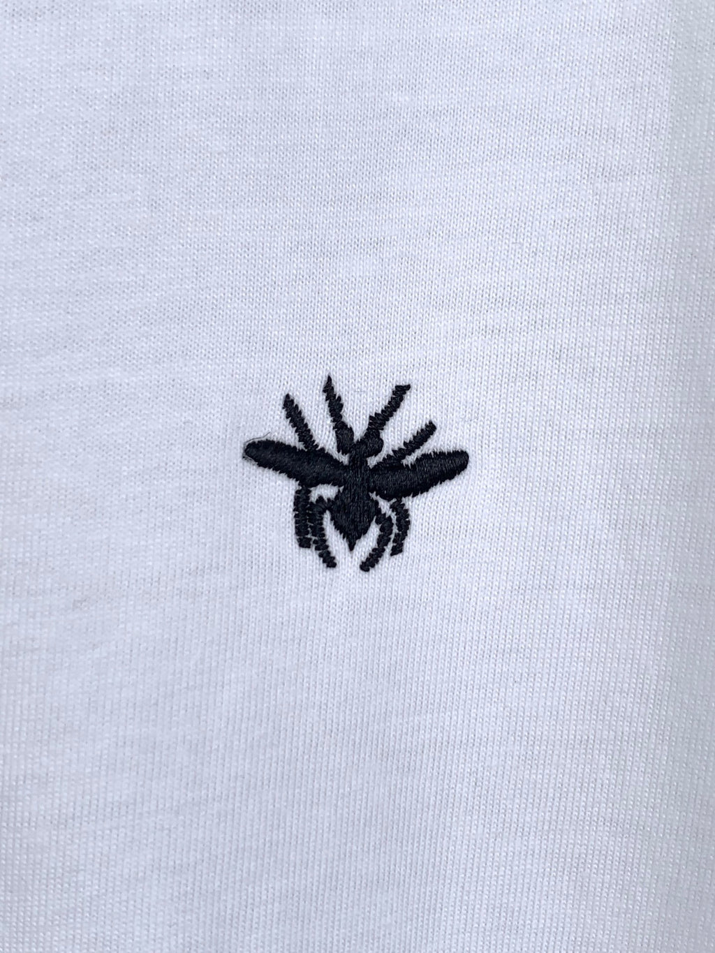 Dior short-sleeve T-shirt, small black emblem detail on white fabric