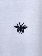 Dior short-sleeve T-shirt, small black emblem detail on white fabric