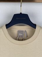 Beige crew-neck T-shirt collar with Dior tag inside