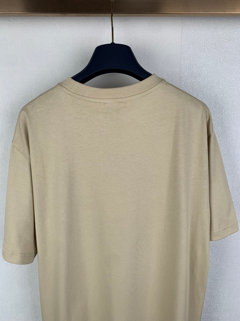 Beige T-shirt back view with crew neckline