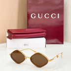 Gold round sunglasses with brown-tinted lenses and pearl beaded temple accents
