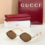 Gold round sunglasses with dark brown lenses and pearl beaded temple accents
