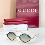 Gold round sunglasses with blue-tinted lenses and pearl beaded temple accents