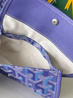 Blue patterned interior pocket with fabric lining and stitched top edge