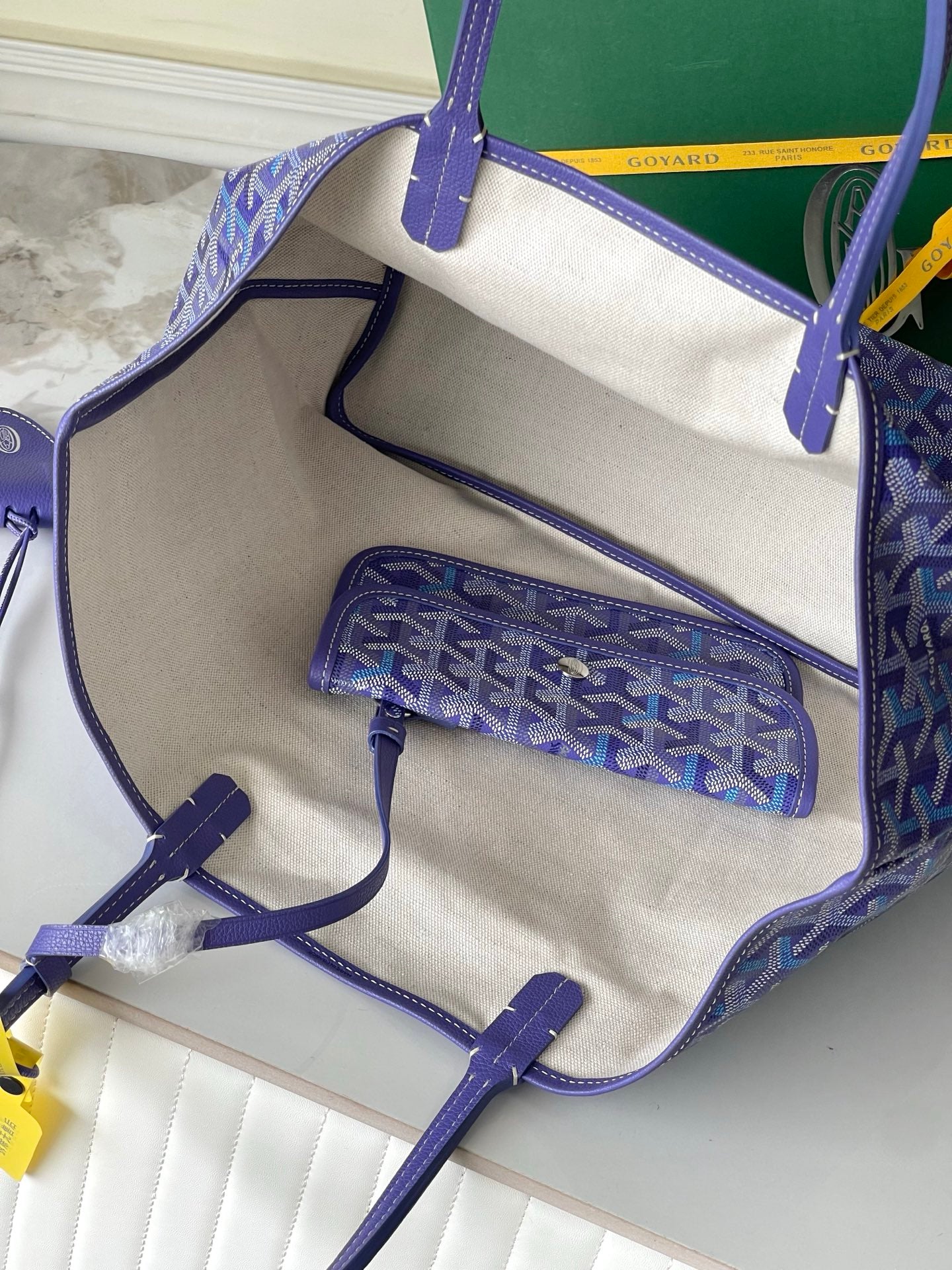 Blue patterned tote interior with zip pouch and exterior pocket