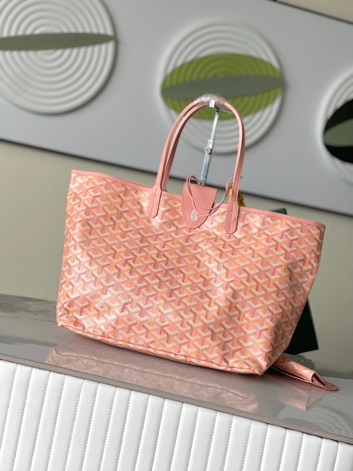 Goyard patterned tote bag in pink with top handles and open, roomy top