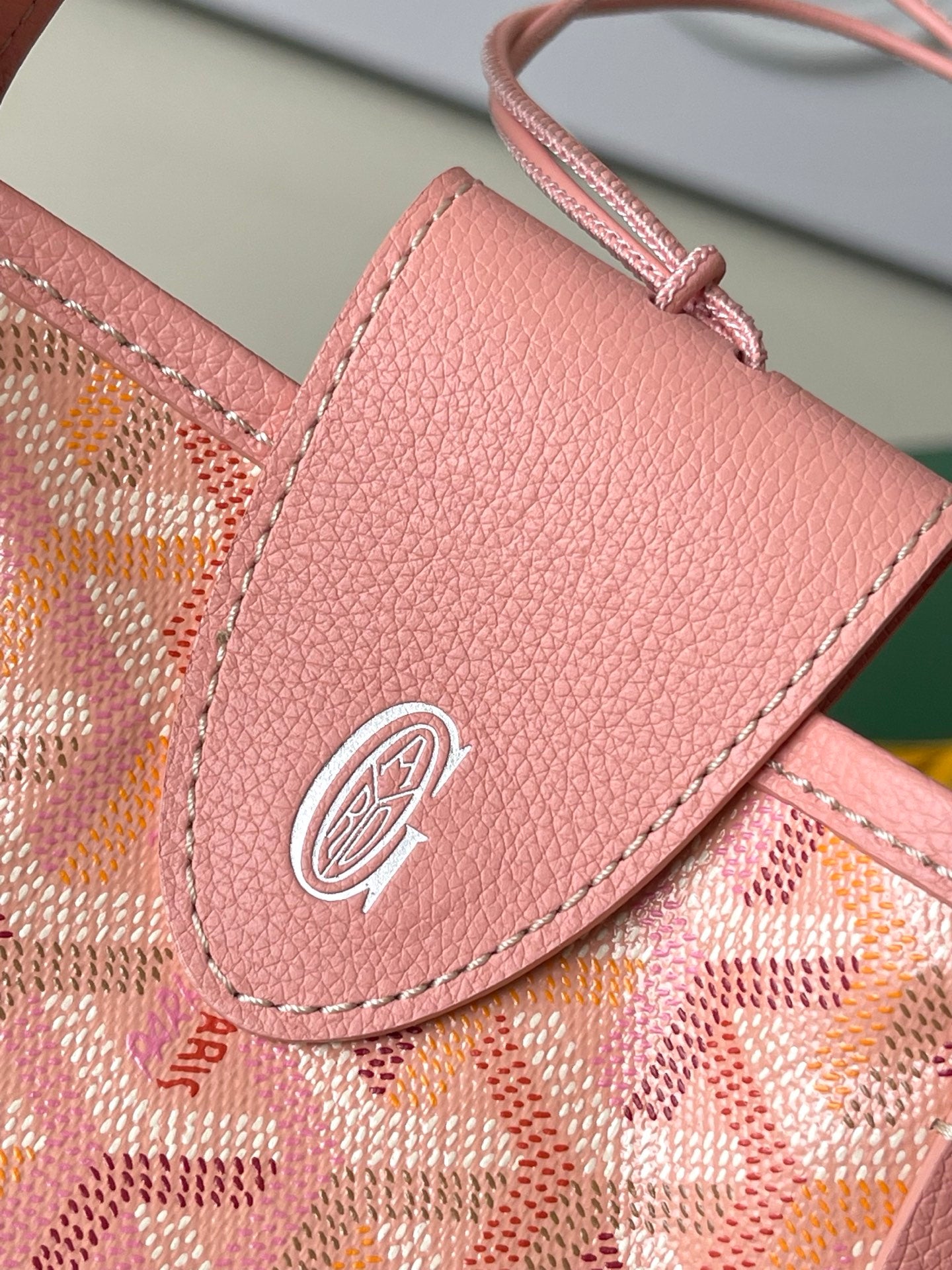 Goyard pink front pouch with snap button and embossed logo on flap