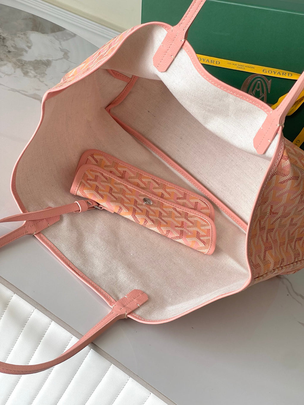 Goyard tote bag open interior with pink trim, beige lining, and zip pocket