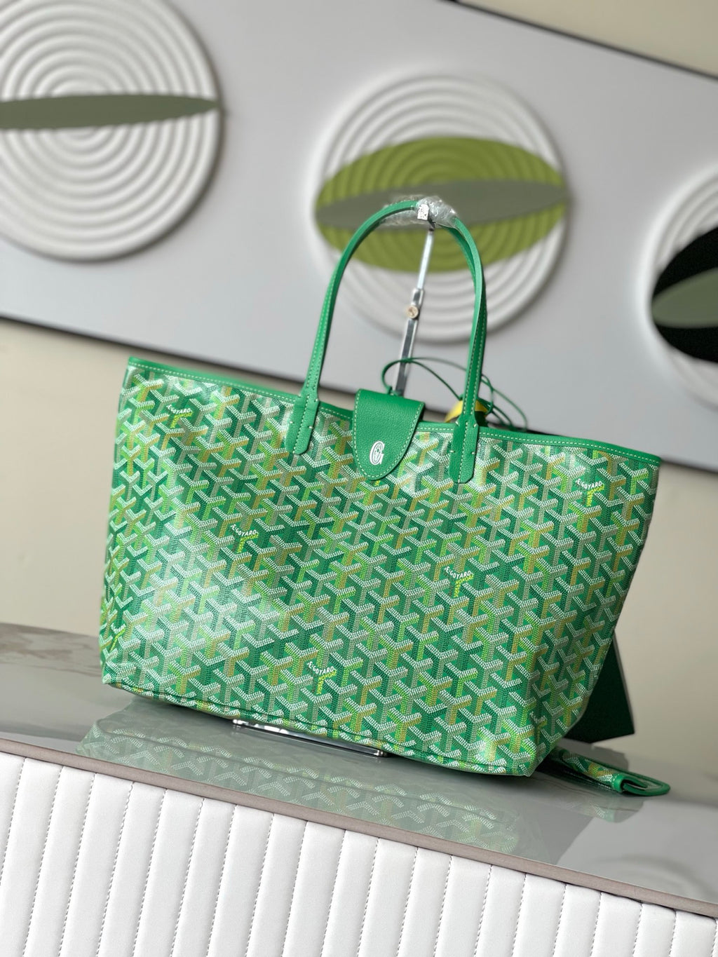 Green patterned tote bag with sturdy top handles and front pocket