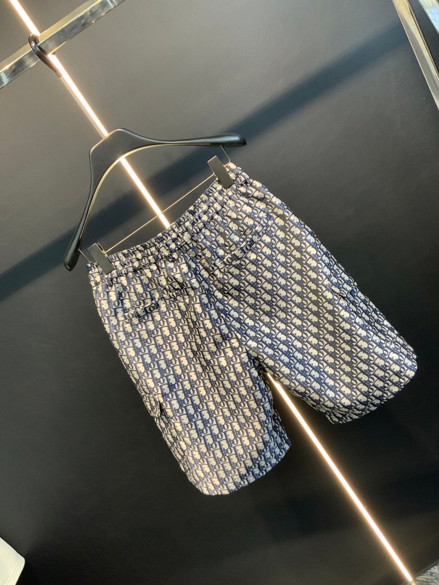 Dior monogram print shorts with elastic waistband, rear angle, blue and cream