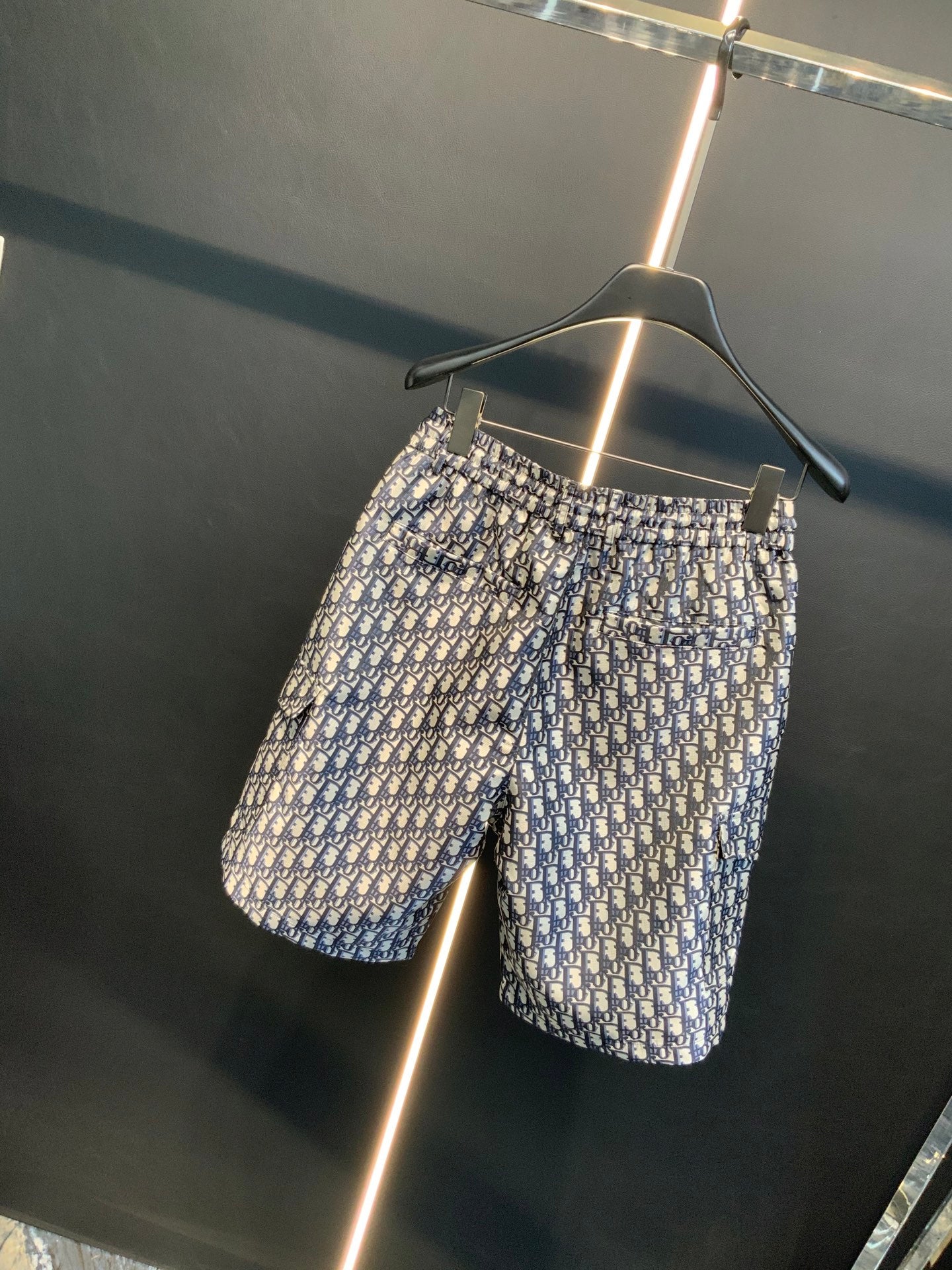 Dior monogram print shorts on hanger, front view, blue and cream