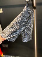 Dior monogram print shorts being held up, fabric detail, blue and cream