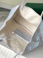 Light blue patterned tote bag open view with beige lining and internal pockets