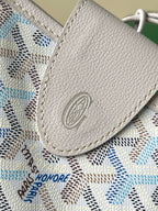 Light blue patterned small pocket with textured flap and embossed emblem