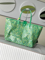 Green patterned tote bag with structured shape and top handles, mint canvas