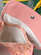 Pink interior lining and logo snap on patterned tote bag