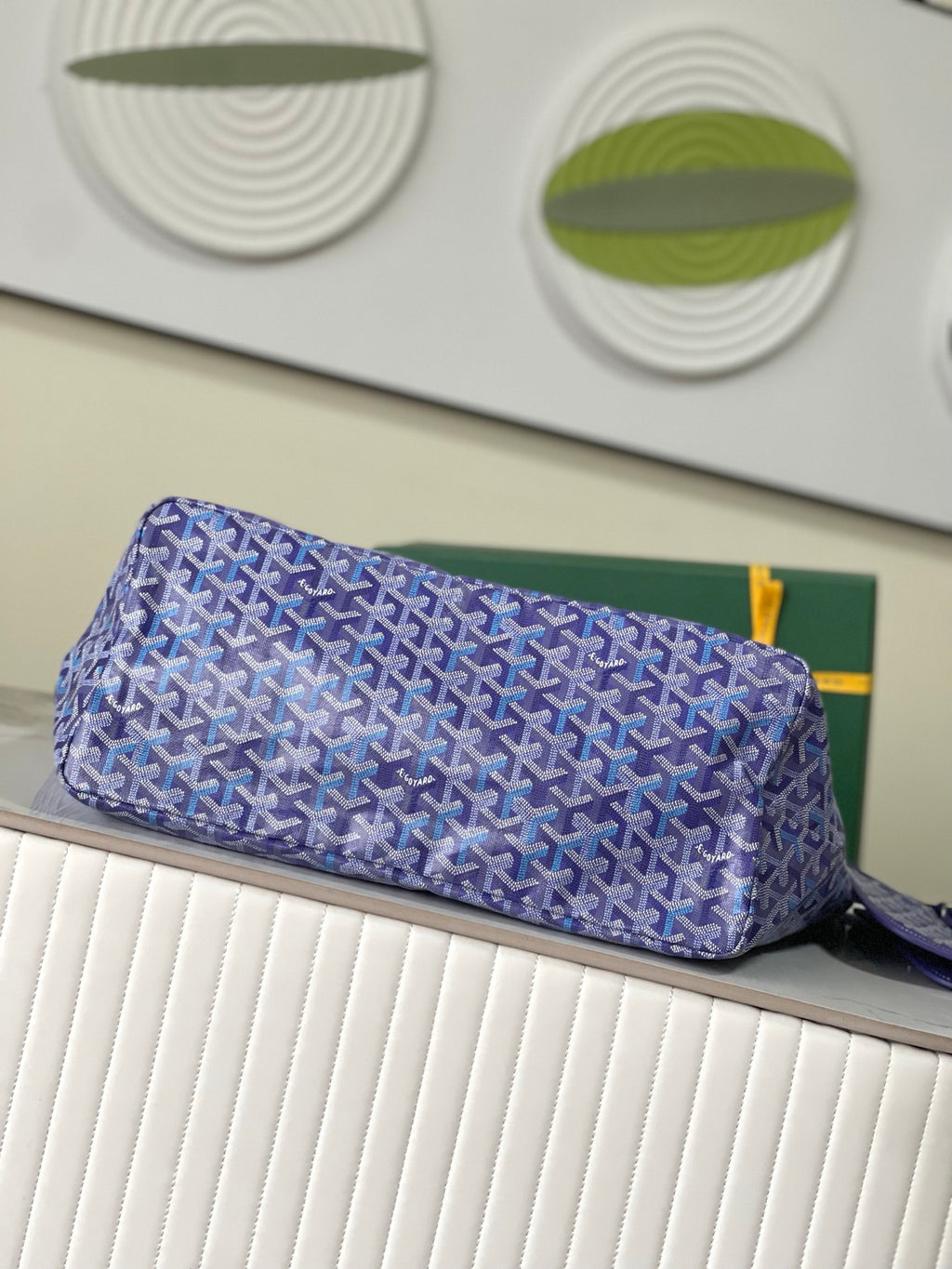 Blue patterned Goyard tote bag with zip top and structured base