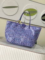 Blue patterned Goyard tote bag with structured shape and top handles