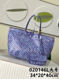 Blue patterned Goyard tote bag with top handles and zip closure