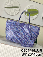 Blue patterned Goyard tote bag with top handles and zip closure