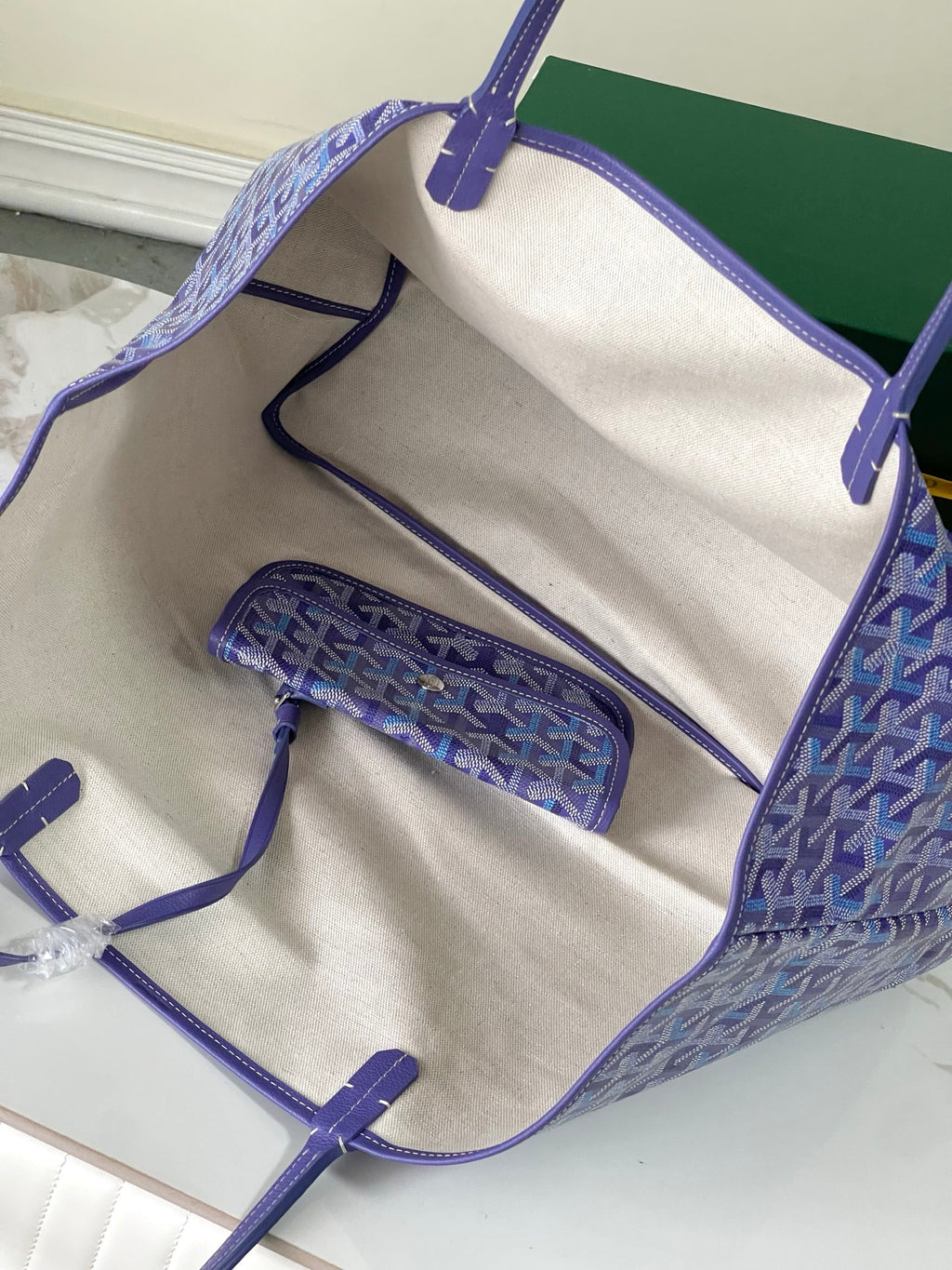 Goyard tote bag open interior view with beige lining and matching pouch