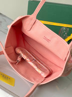 Pink tote bag interior with zipper pouch and open top, showing inner compartments.