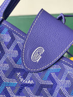 Blue leather Goyard emblem patch on patterned flap with visible stitching
