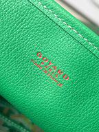Green Goyard leather label patch with embossed logo text