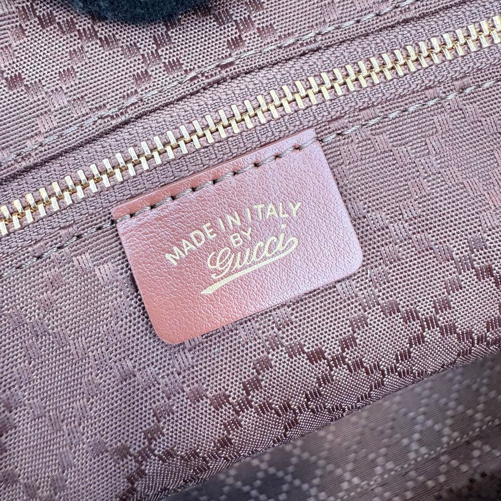 Gucci tote bag label reading "MADE IN ITALY" with Gucci logo on interior