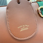 Gucci bag leather flap with stitched edge and “Made in Italy” logo