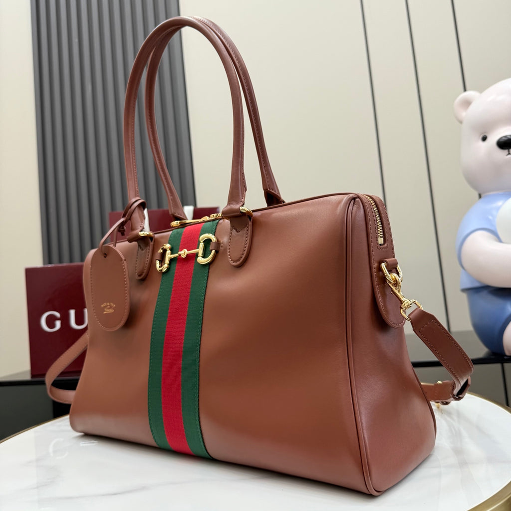 Brown Gucci leather tote bag with green-and-red stripe and gold-tone side rings