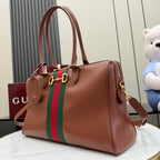 Brown Gucci leather tote bag with green-and-red stripe and gold-tone side rings