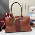 Brown leather Gucci tote bag with green-and-red web stripe and top handles