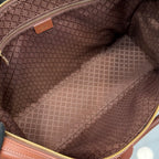 Gucci tote bag interior lining in brown with zipper opening and gold trim