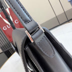 Gucci bag leather handle with dark blue stitching and silver-tone metal ring