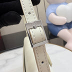 Gucci bag strap with light beige leather, contrast stitching, and silver buckle clasp