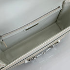 Cream bag interior view with zippered top edge, lining, and inner metal zipper pull
