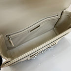 Gucci mini bag interior in light beige with zippered pocket and silver zipper.