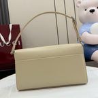 Gucci mini bag in light beige with top handle and front flap.