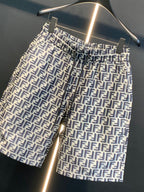 Dior logo-pattern shorts on hanger, close view of waistband and leg openings.