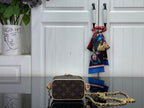 Monogram vanity bag with gold chain strap, brown canvas and tan top trim