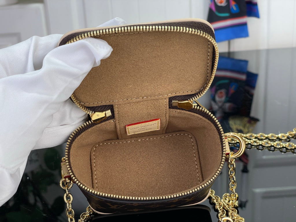 Monogram vanity bag open top pocket with gold zipper, brown fabric lining