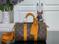 Louis Vuitton monogram handbag with orange leather handles and crossbody strap