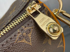 Louis Vuitton monogram bag zipper pull with gold charm and LV text