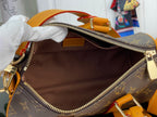 Louis Vuitton monogram bag interior with brown lining and zippered top opening